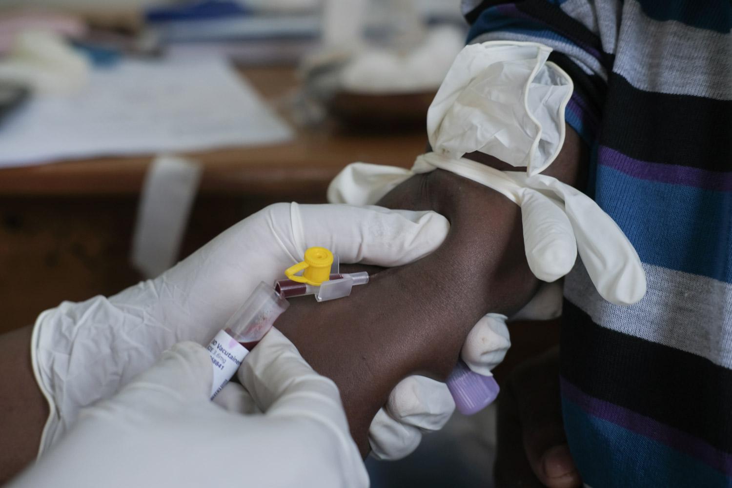 A child participates in the yellow fever clinical trial