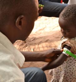 A child's nutritional status is checked by measuring the upper arm circumference