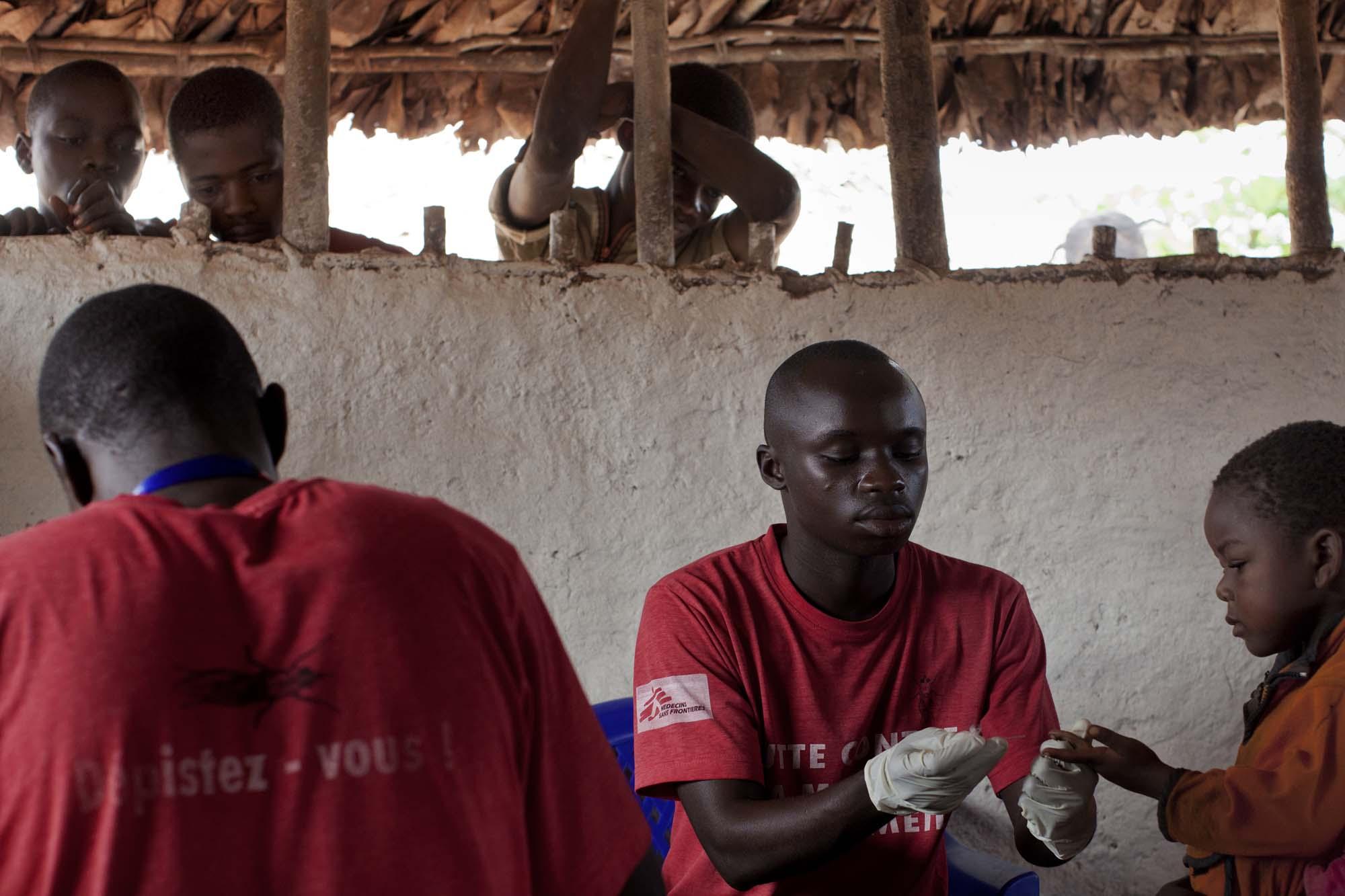 Médecins Sans Frontières (MSF) mobile clinic staff runs blood tests to diagnose sleeping sickness in  the village of Emmaus, northeast DRC.